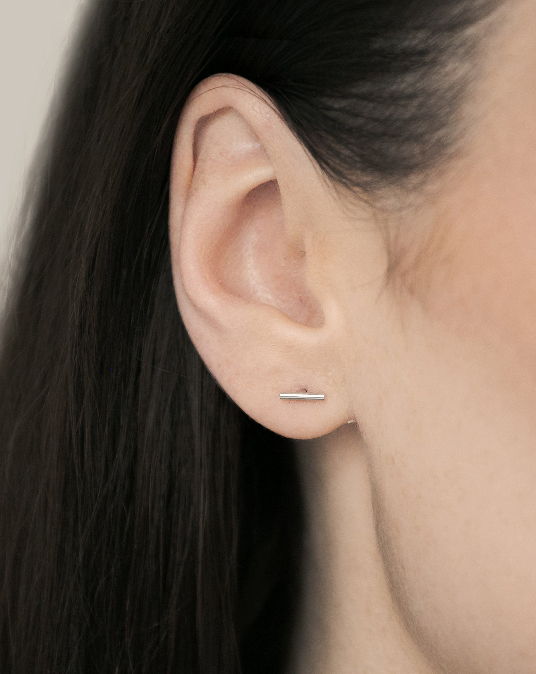 A single bar sterling silver line stud earring
